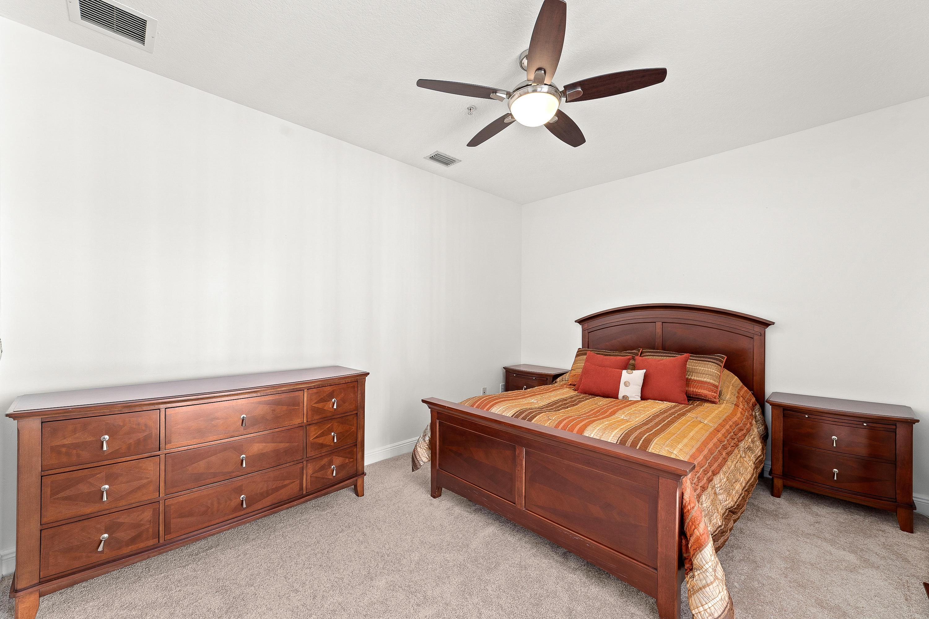 613 Northwest 38th Circle Boca Raton, FL 33431 - Photo 29 of 31 a room with a bed and a dresser