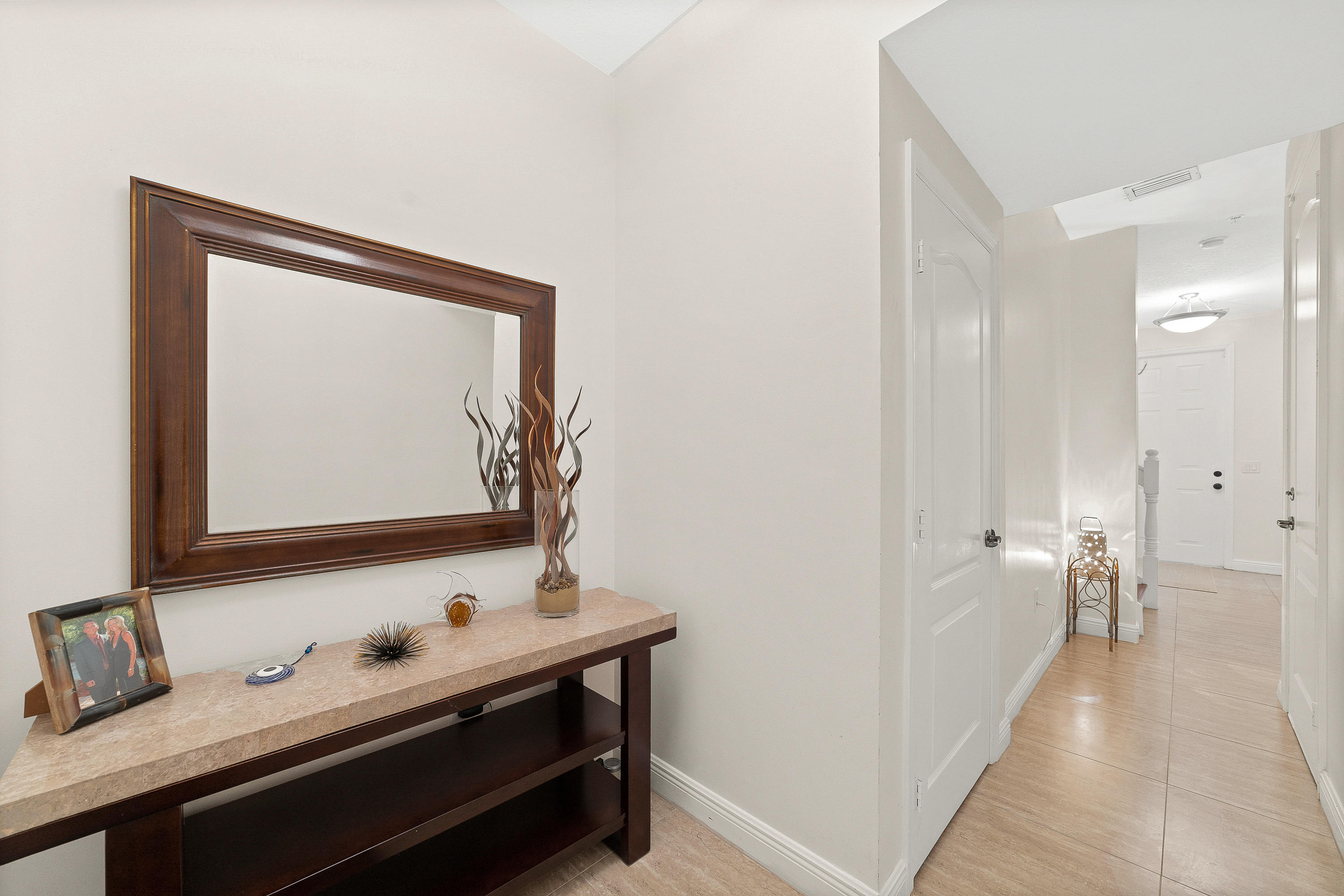 613 Northwest 38th Circle Boca Raton, FL 33431 - Photo 3 of 31 a bathroom with a sink and a mirror