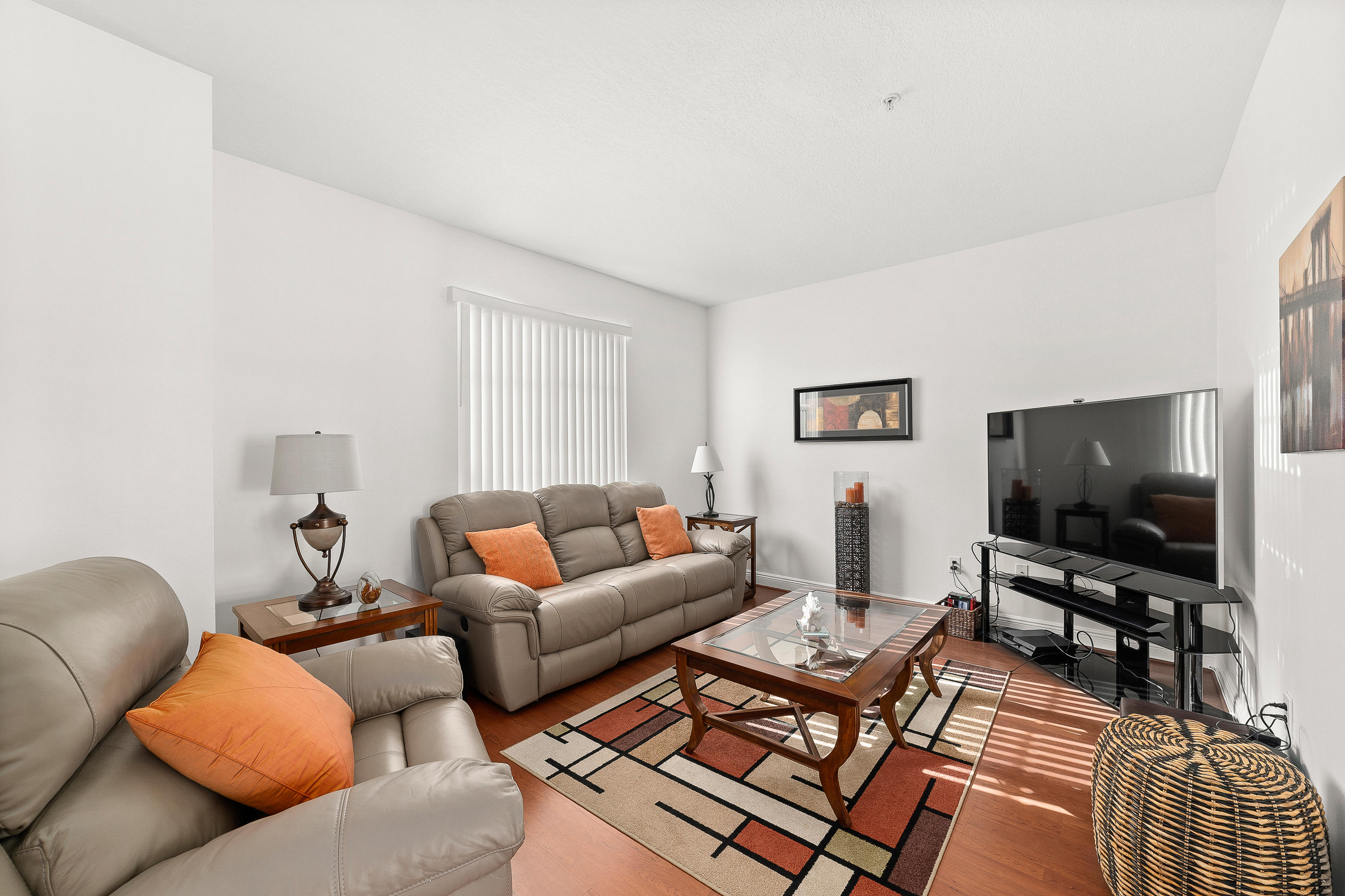 613 Northwest 38th Circle Boca Raton, FL 33431 - Photo 8 of 31 a living room with furniture and a flat screen tv