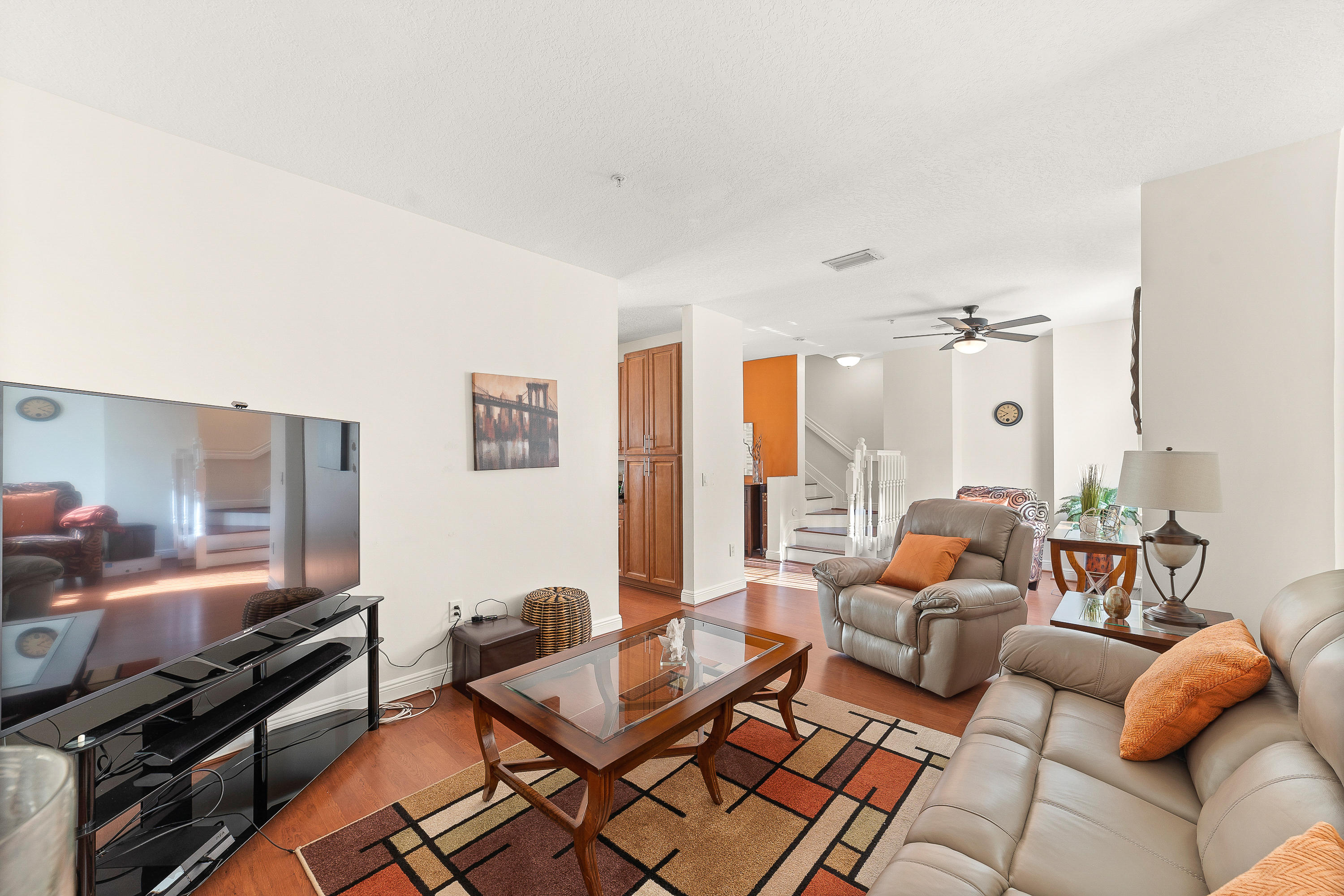 613 Northwest 38th Circle Boca Raton, FL 33431 - Photo 10 of 31 a living room with furniture and a flat screen tv