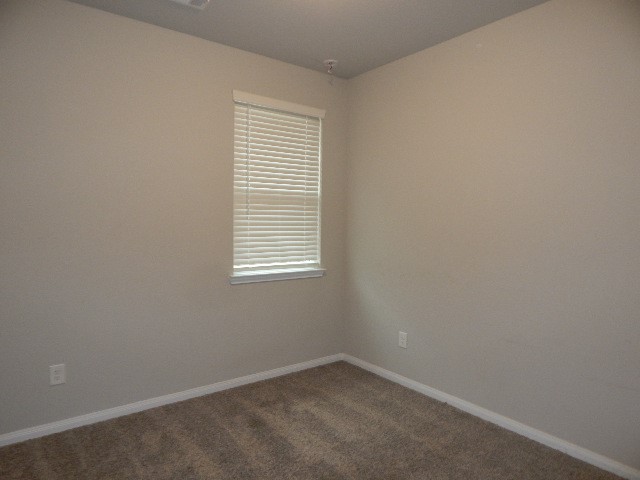7103 Silverleaf Oak Street Conroe, TX 77304 - Photo 16 of 20 an empty room with a window