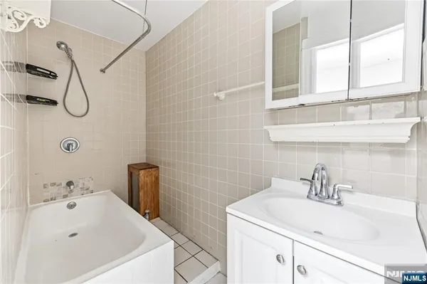a bathroom with a sink and a bathtub