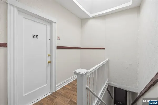 a view of entryway with wooden floor