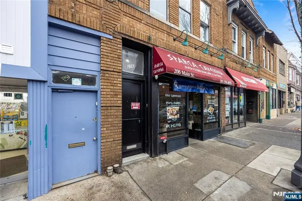 a view of a building with retail shops