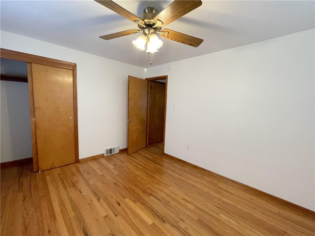 1658 Pulaski Road New Castle, PA 16105 - Photo 6 of 21 a view of an empty room with wooden floor