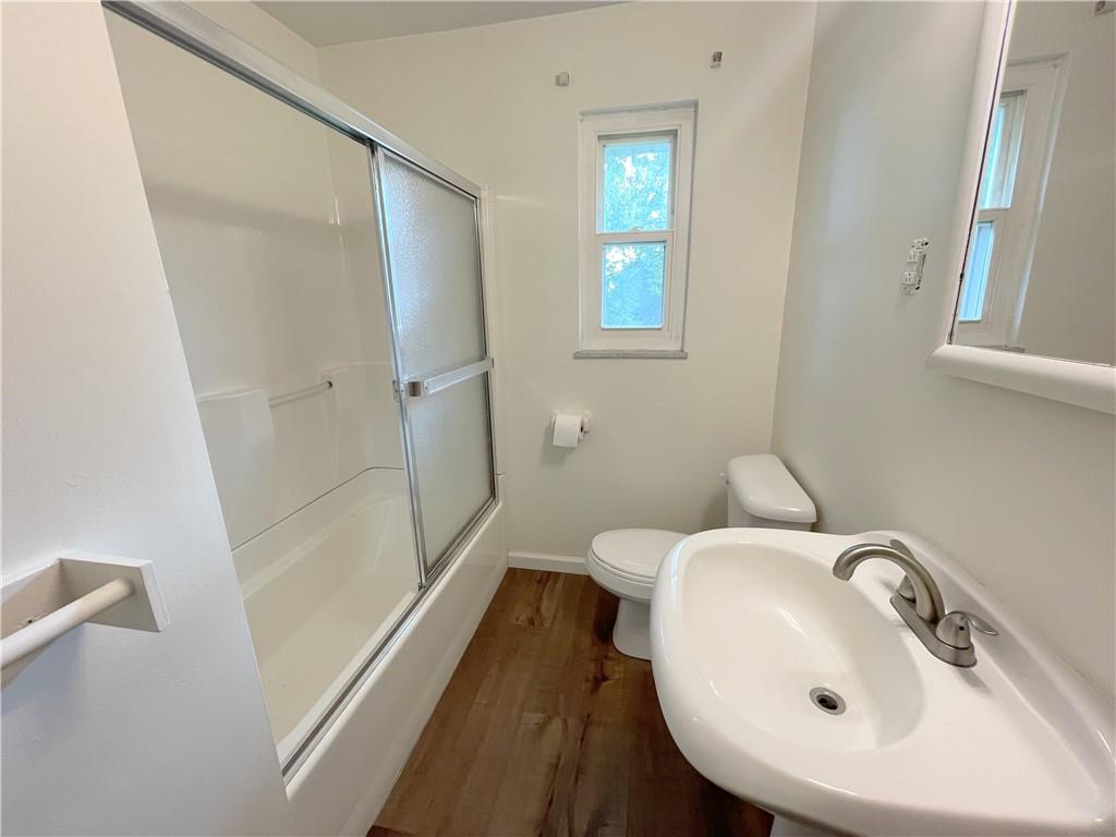 1658 Pulaski Road New Castle, PA 16105 - Photo 9 of 21 a bathroom with a sink a toilet and shower