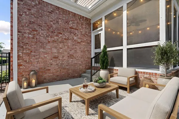 a outdoor living space with furniture and a potted plant