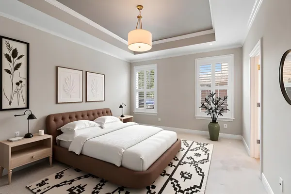 a bedroom with bed and a chandelier