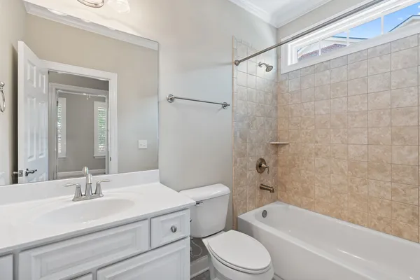 a bathroom with a sink a toilet and a bathtub