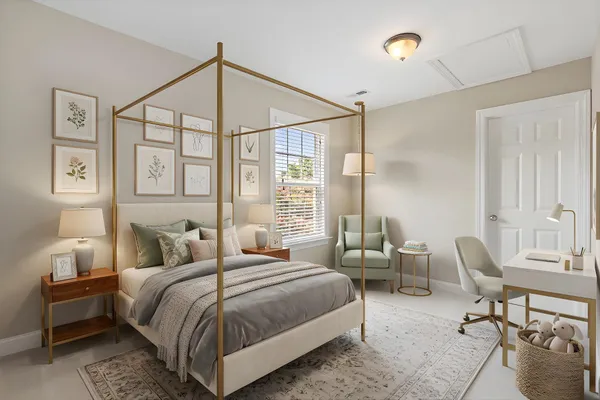 a bedroom with a bed a chair and next to a window