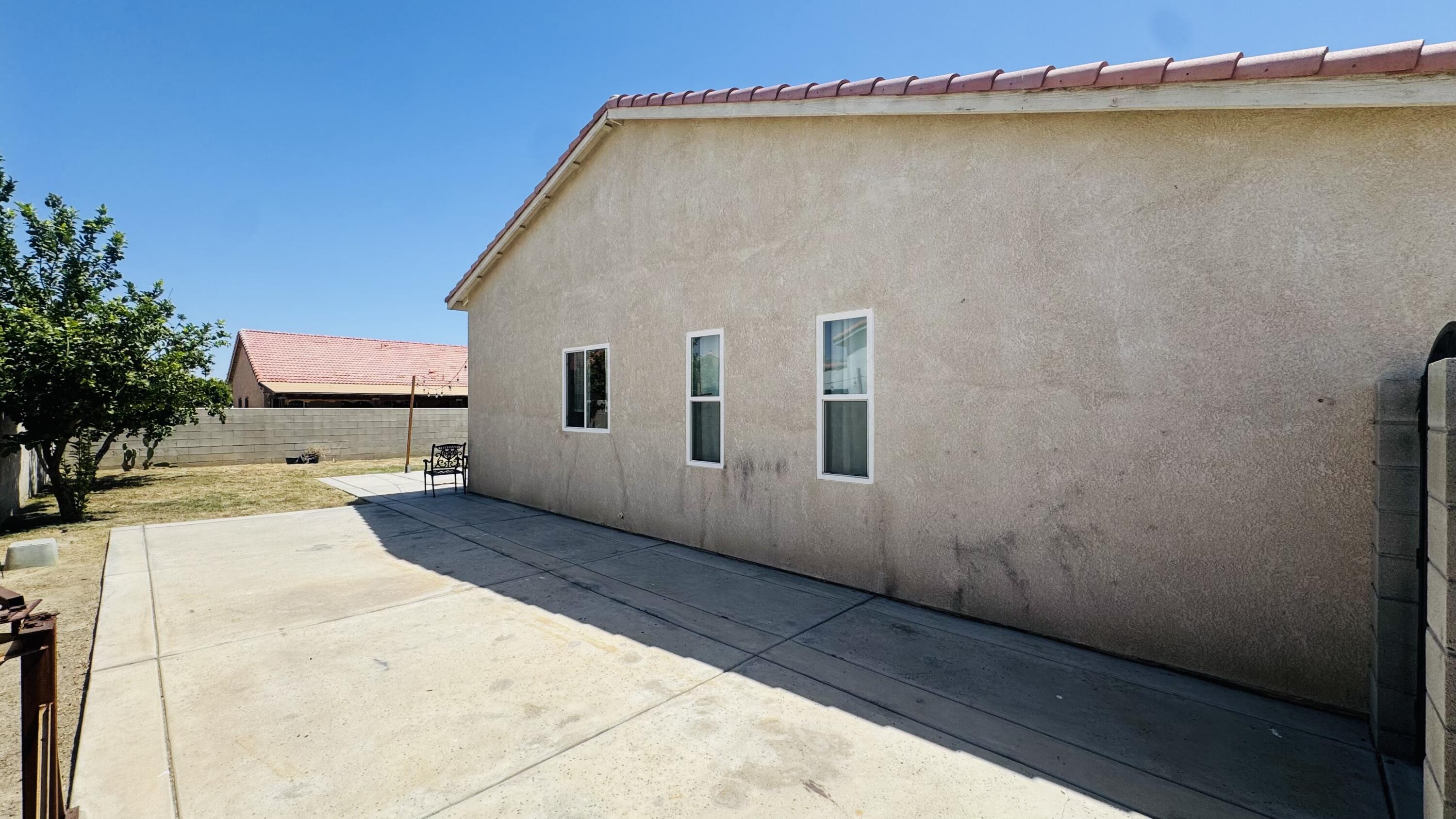 47818 Phoenix Street Indio, CA 92201 - Photo 4 of 14 a view of a house with a backyard