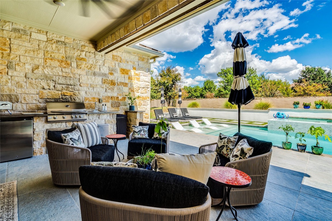 109 Bisset Court Austin, TX 78738 - Photo 3 of 34 a living room with patio furniture and a potted plant