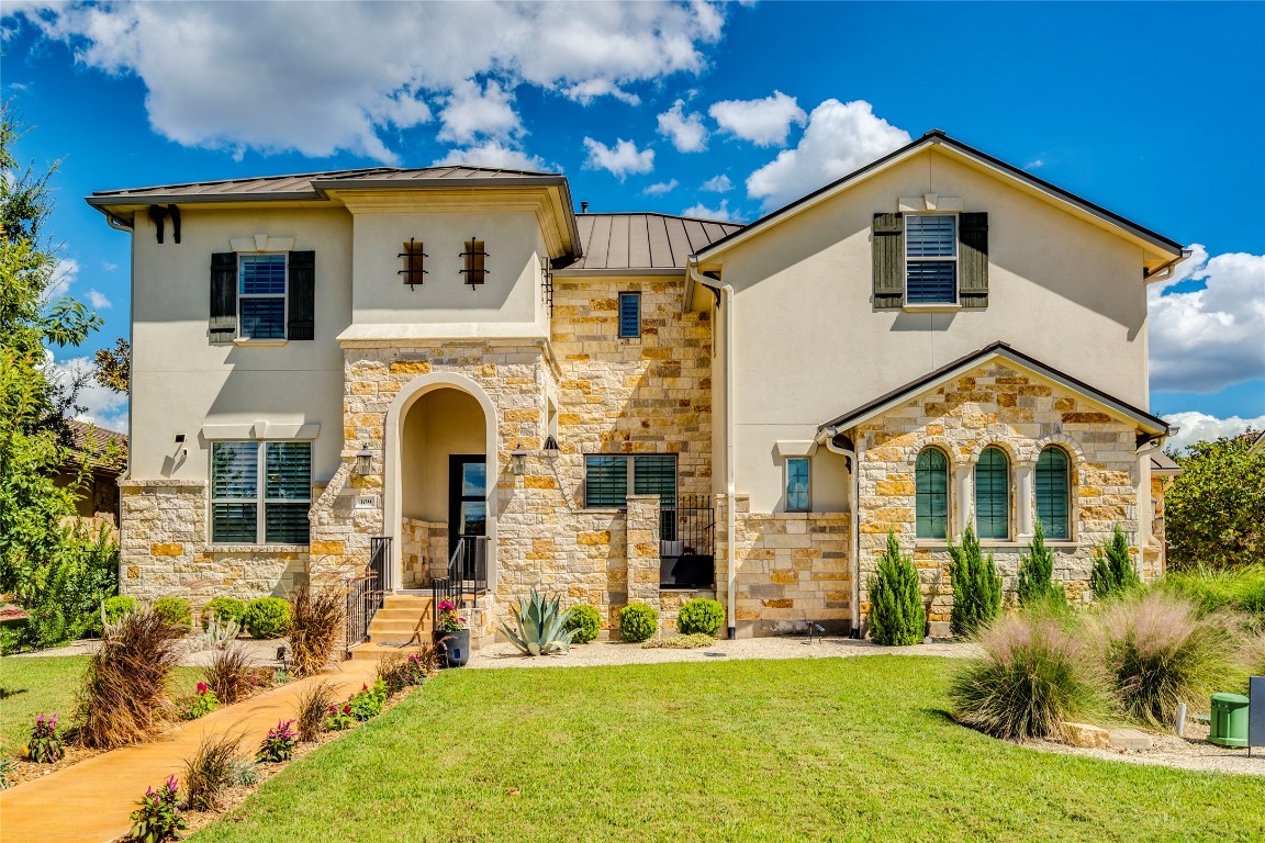 109 Bisset Court Austin, TX 78738 - Photo 32 of 34 a front view of a house with a yard