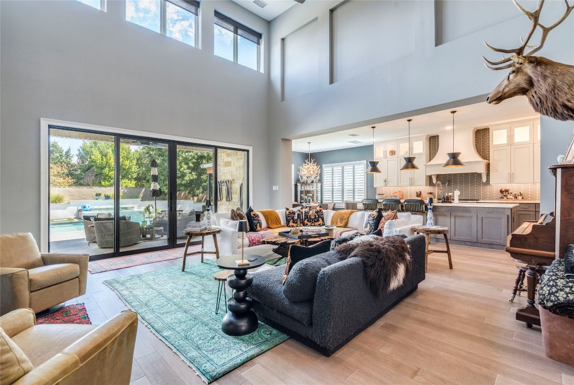 109 Bisset Court Austin, TX 78738 - Photo 8 of 34 a living room with furniture and a floor to ceiling window