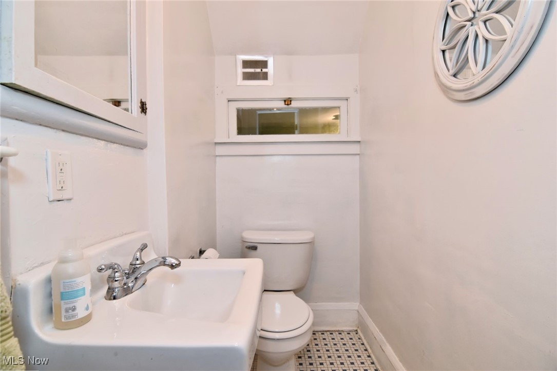 17930 Rosecliff Road Cleveland, OH 44119 - Photo 24 of 50 Half bath featuring toilet and baseboards