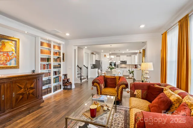 a view of a hallway with wooden floor and entryway