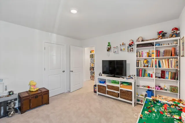 a bathroom with a granite countertop sink toilet mirror and shower