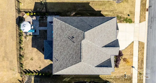 a view of a patio with swimming pool table and chairs