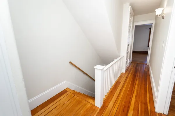 wooden floor in an empty room with a closet