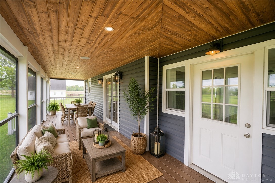 190 Swailes Road Troy, OH 45373 - Photo 35 of 82 This inviting porch, featuring rich wood ceilings and durable flooring, offers ample space for entertaining.