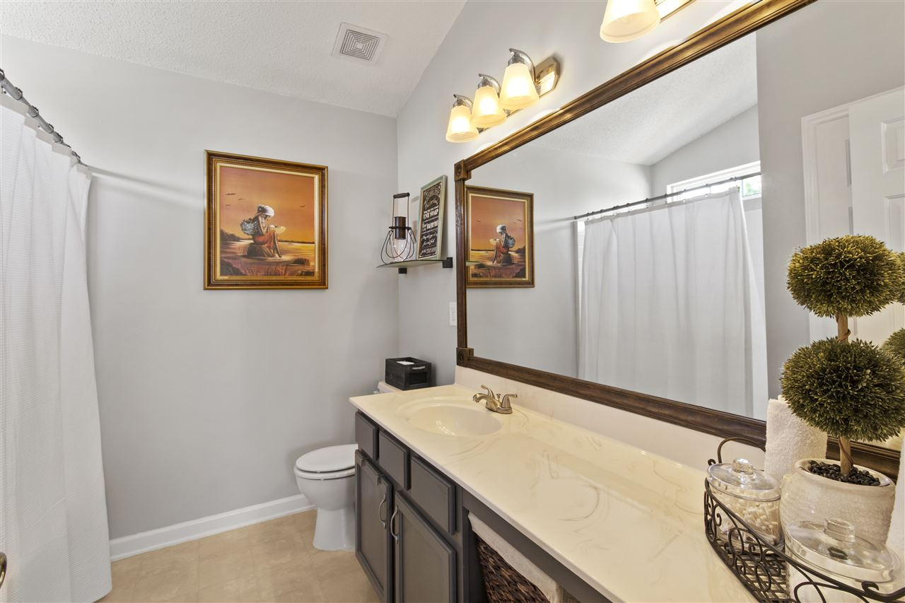 3301 Marshlane Way Raleigh, NC 27610 - Photo 17 of 27 New lighting, new mirror, refinished cabinets, and cultured marble countertops Owners' Bath