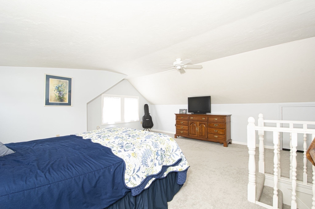 15 Monroe Street Shrewsbury, MA 01545 - Photo 16 of 30 a bedroom with a bed and a couch