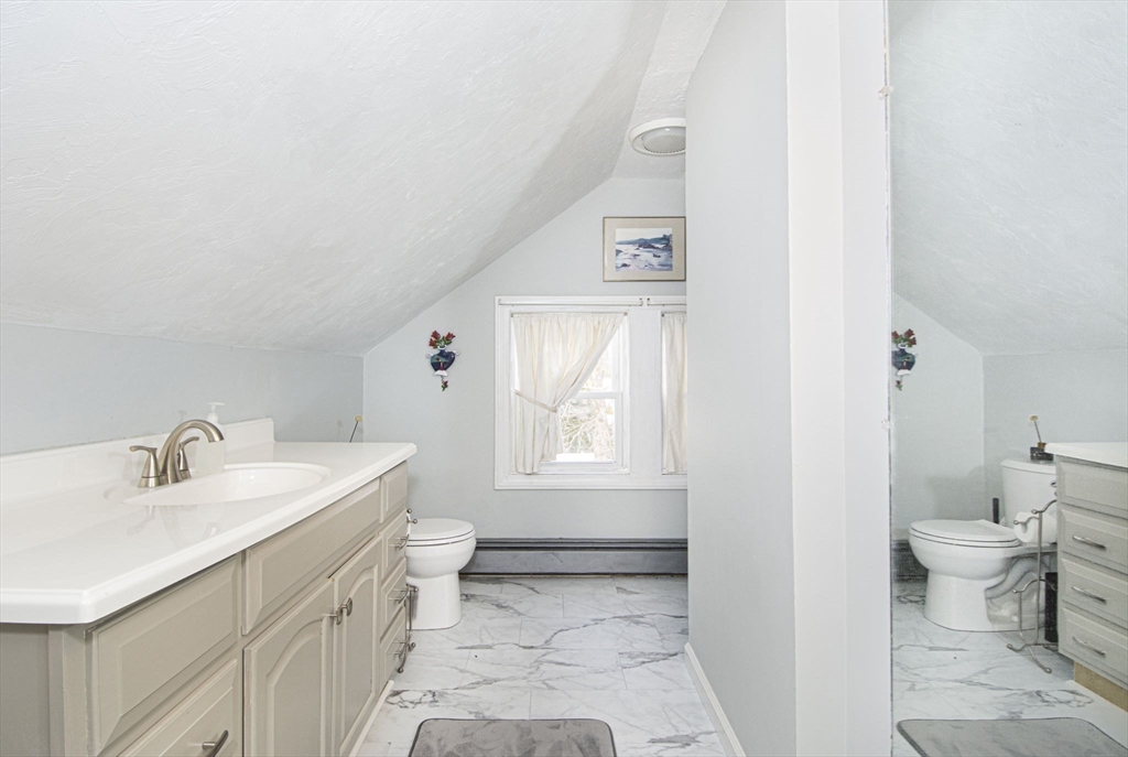 15 Monroe Street Shrewsbury, MA 01545 - Photo 17 of 30 a view of bathroom with a sink toilet and a bathtub