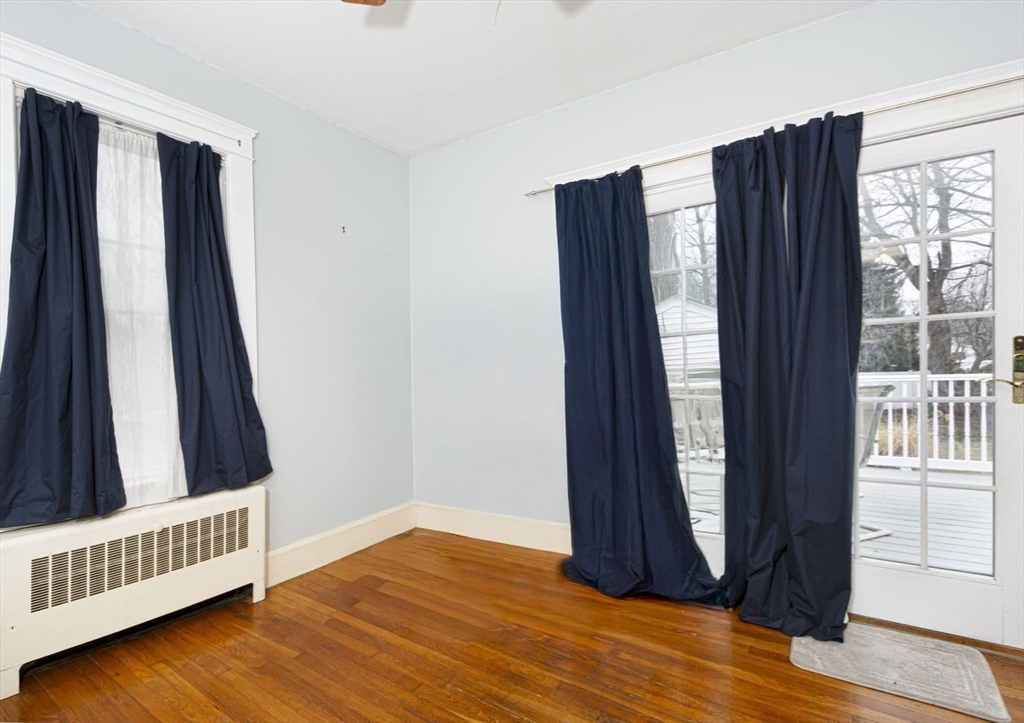 15 Monroe Street Shrewsbury, MA 01545 - Photo 18 of 30 an empty room with wooden floor and windows
