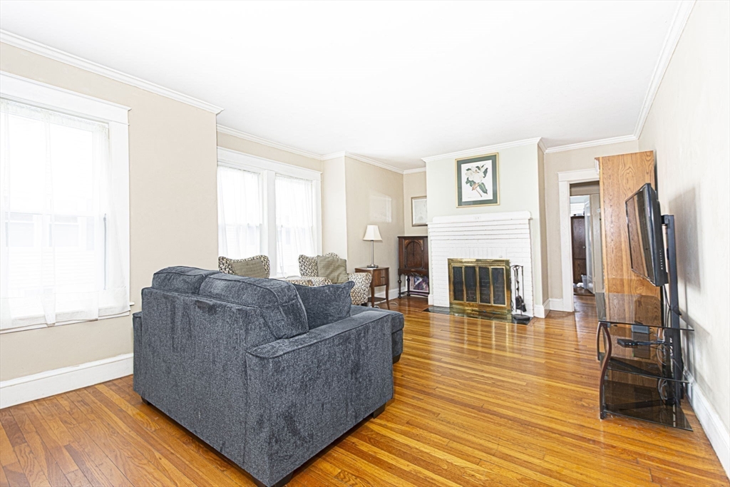 15 Monroe Street Shrewsbury, MA 01545 - Photo 2 of 30 a living room with furniture and a fireplace
