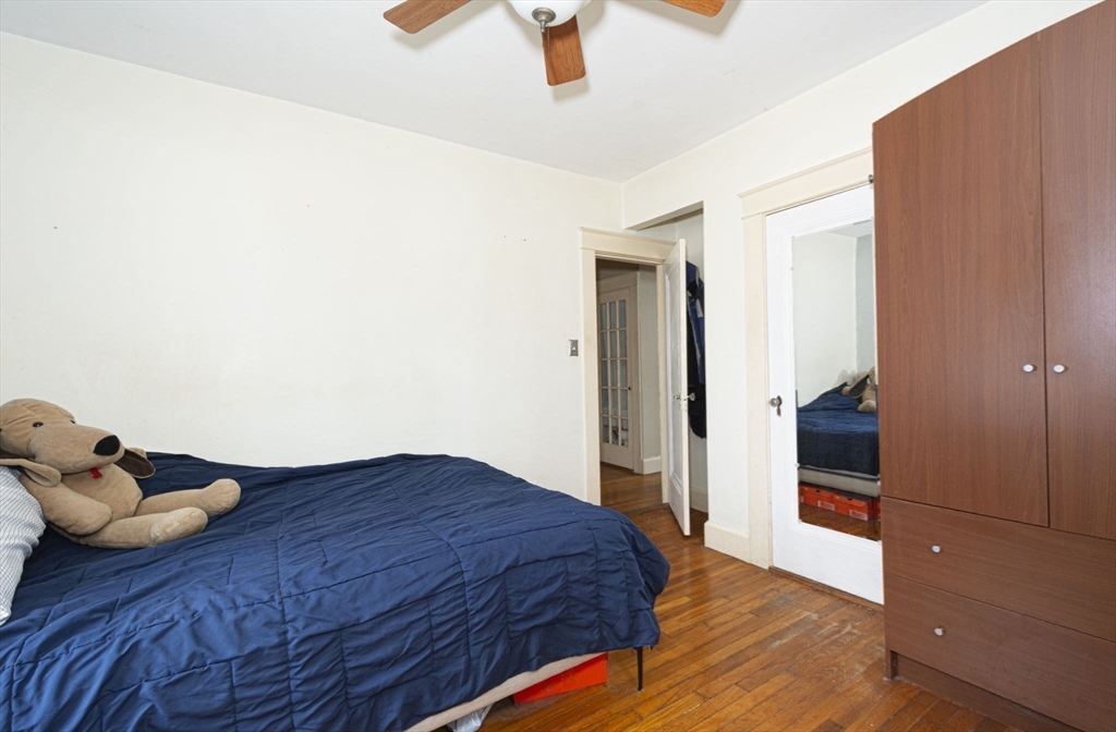 15 Monroe Street Shrewsbury, MA 01545 - Photo 21 of 30 a bedroom with a bed and cabinets