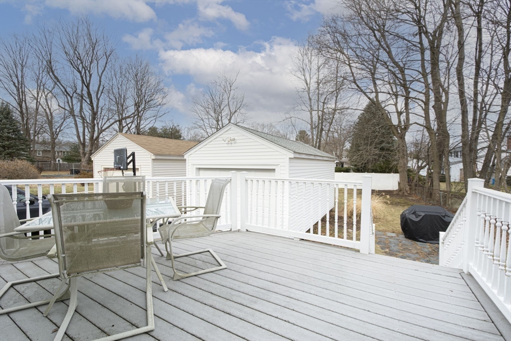 15 Monroe Street Shrewsbury, MA 01545 - Photo 23 of 30 a view of a roof deck with couches and wooden fence