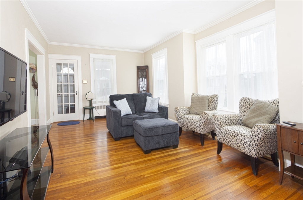 15 Monroe Street Shrewsbury, MA 01545 - Photo 4 of 30 a living room with furniture and a wooden floor