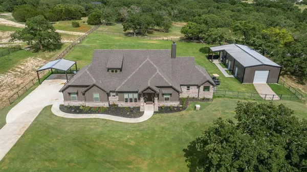an aerial view of a house with a garden