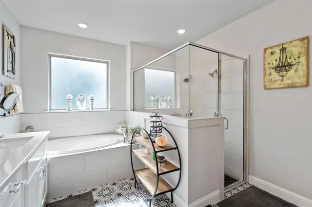 a bathroom with a bathtub and a mirror