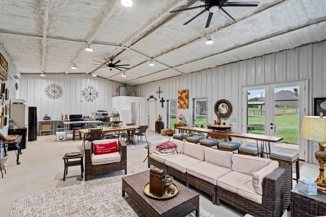 a living room with lots of furniture and a flat screen tv