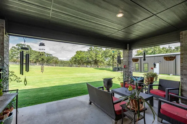 a balcony with furniture and garden