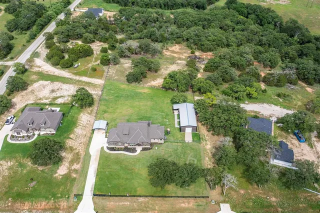 an aerial view of residential house with outdoor space