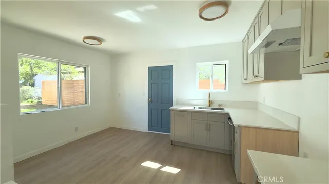 a kitchen with sink and window