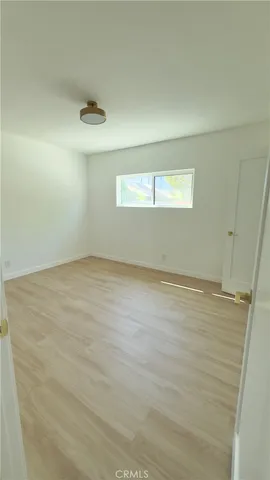 an empty room with a empty space and a window