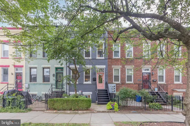 a front view of a multi story residential apartment buildings