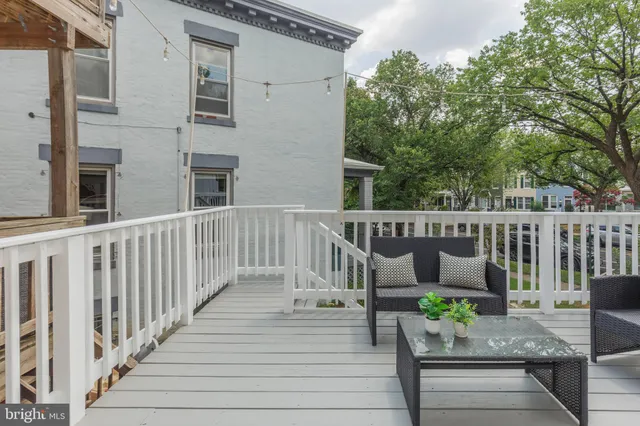 a bedroom with a bed and a chair