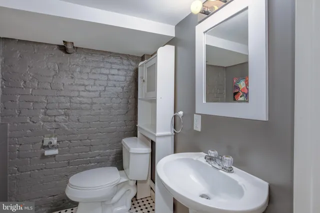 a front view of a residential apartment building with a yard