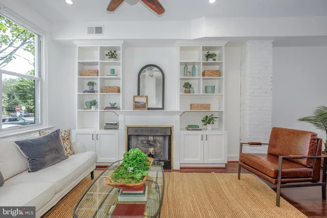 a dining room with furniture entryway and wooden floor