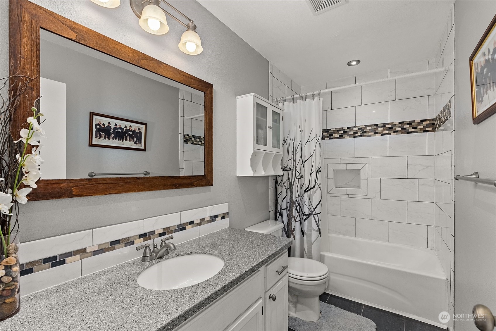 19930 Tahoma Circle Southwest Rochester, WA 98579 - Photo 20 of 29 a bathroom with a granite countertop sink mirror toilet and a bathtub