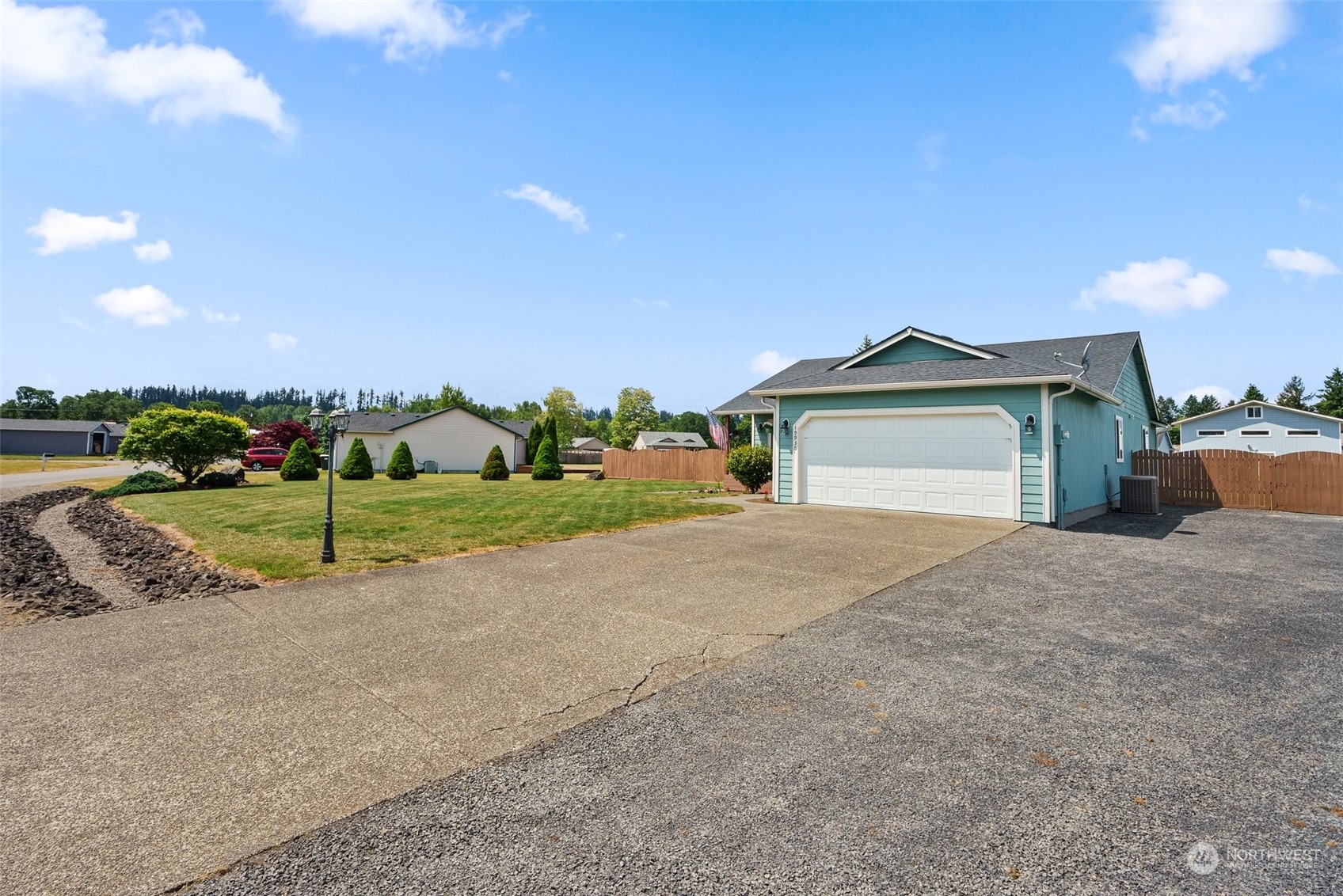 19930 Tahoma Circle Southwest Rochester, WA 98579 - Photo 23 of 29 a front view of a house with a yard and garage