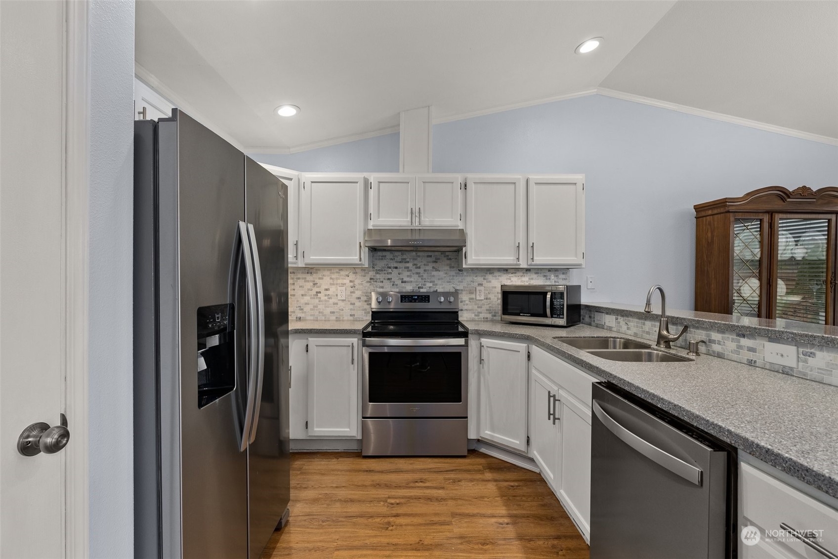 19930 Tahoma Circle Southwest Rochester, WA 98579 - Photo 9 of 29 a kitchen with stainless steel appliances granite countertop a stove a refrigerator and a sink