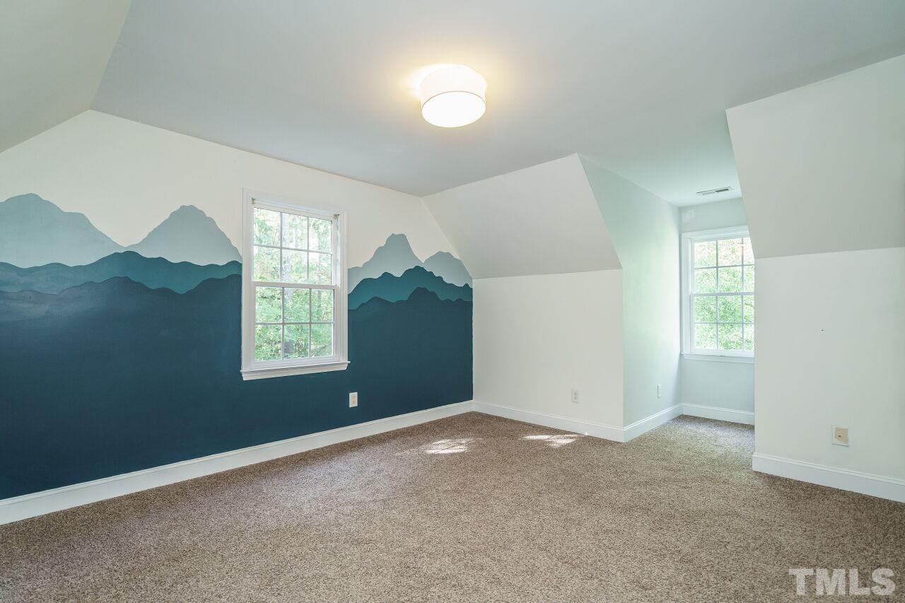 4202 Holt School Road Durham, NC 27704 - Photo 22 of 27 a view of an empty room with a window