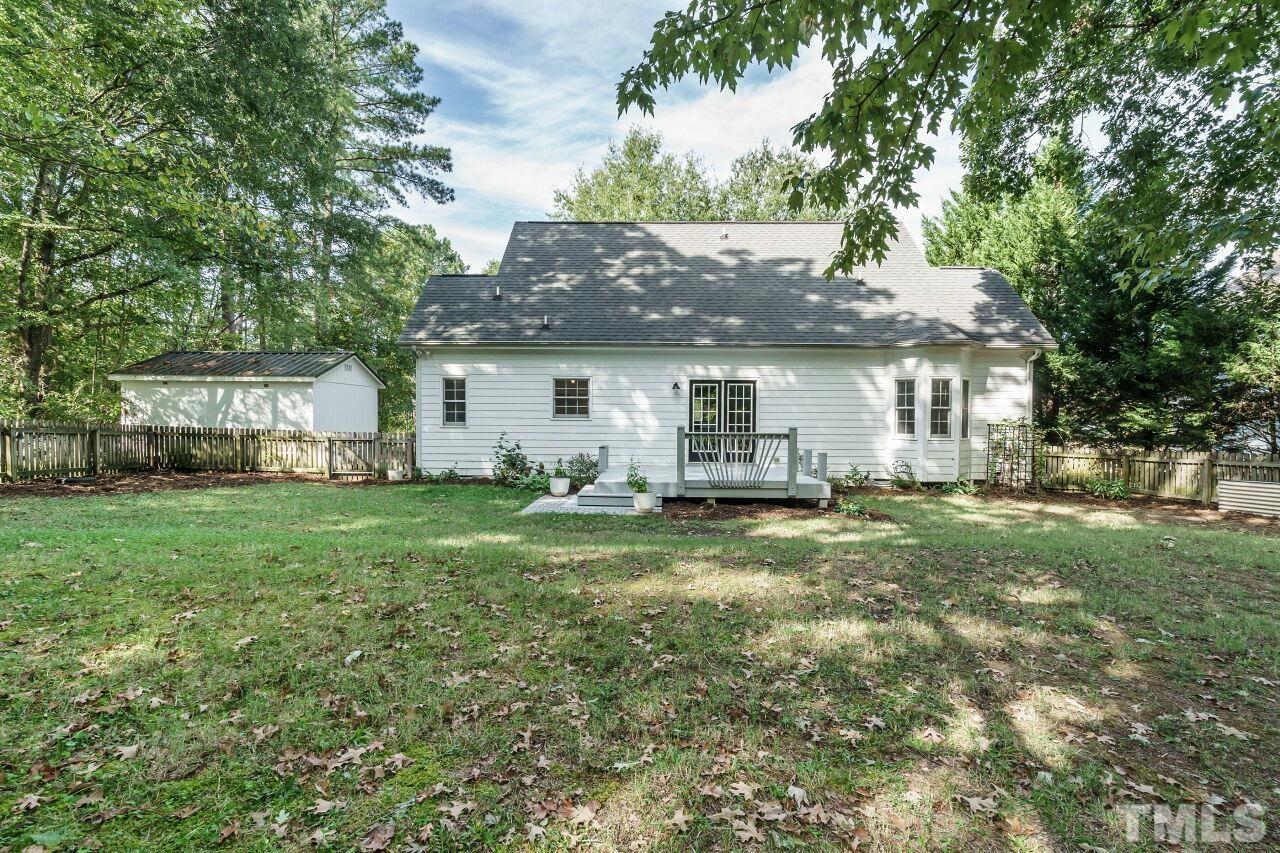4202 Holt School Road Durham, NC 27704 - Photo 24 of 27 a view of a house with a backyard