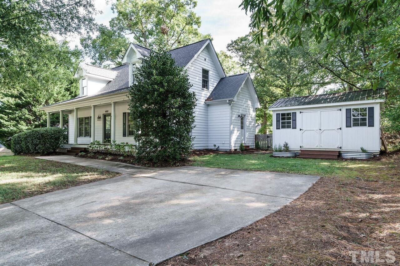 4202 Holt School Road Durham, NC 27704 - Photo 26 of 27 a view of backyard of house with green space