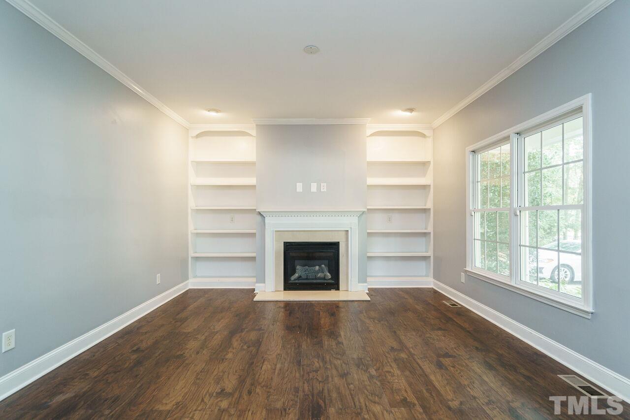 4202 Holt School Road Durham, NC 27704 - Photo 4 of 27 a view of a room wooden floor and windows in a room